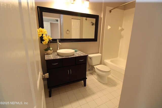 bathroom with toilet, vanity,  shower combination, tile patterned flooring, and baseboards