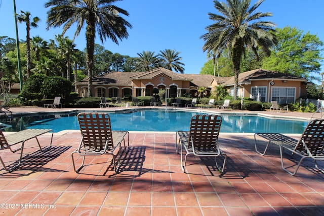 community pool featuring a patio area