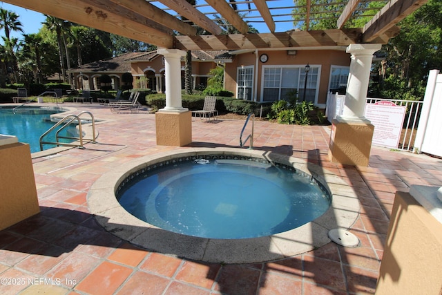 pool featuring a patio area, a community hot tub, and a pergola