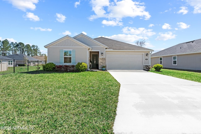 view of front facade featuring fence, driveway, a front lawn, stone siding, and a garage