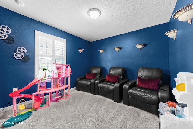 home theater room with baseboards, a textured ceiling, and carpet