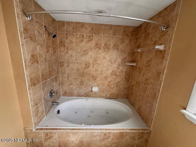 bathroom featuring a combined bath / shower with jetted tub