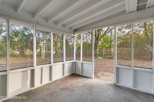 unfurnished sunroom with a wealth of natural light and vaulted ceiling