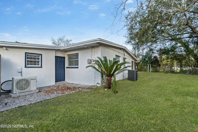 exterior space featuring ac unit, central AC unit, and a yard