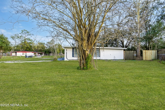 view of yard with fence