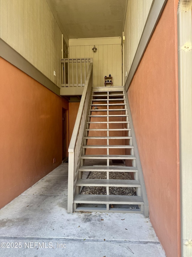 stairway with concrete floors