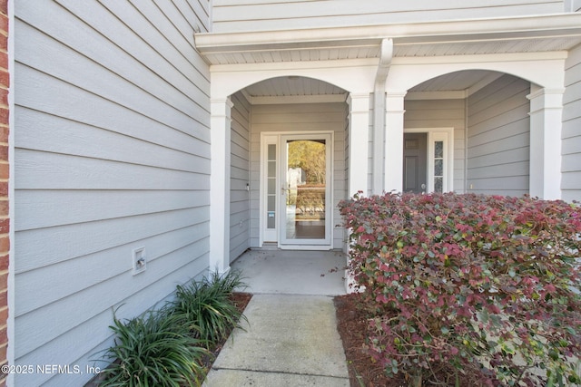 doorway to property with a porch