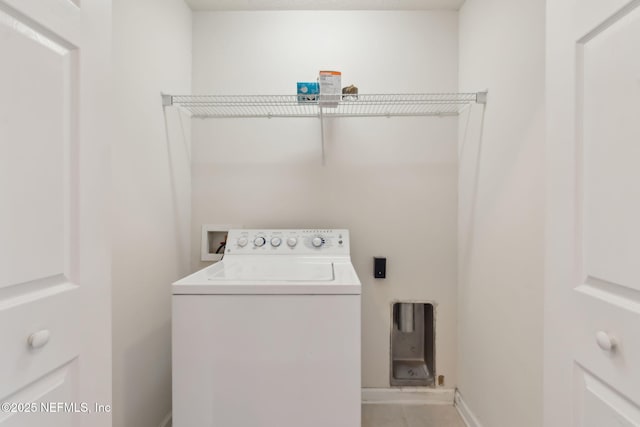 laundry area with washer / clothes dryer, baseboards, and laundry area