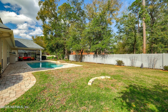 view of yard with a patio area, a fenced in pool, and a fenced backyard