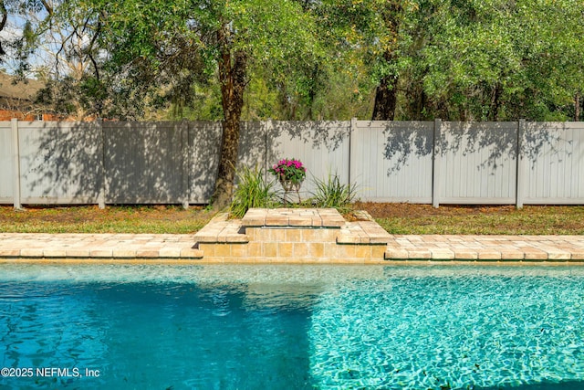 view of pool with fence and a fenced in pool