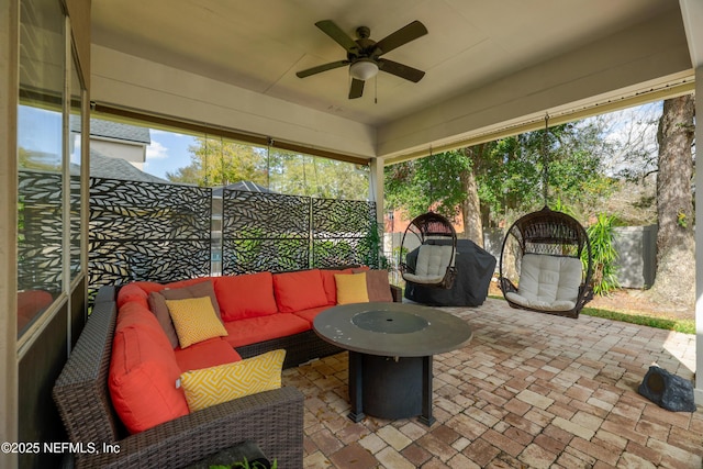 view of patio / terrace featuring a ceiling fan, a fenced backyard, and an outdoor hangout area