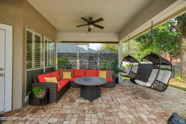 view of patio / terrace with an outdoor living space and a ceiling fan