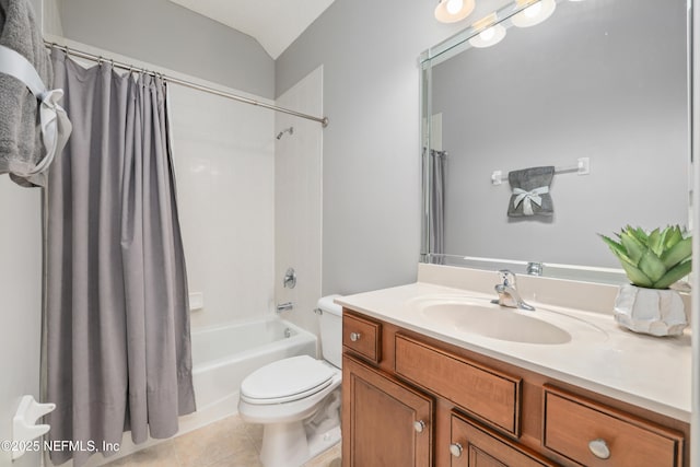 bathroom featuring tile patterned flooring, toilet, vanity, and shower / tub combo