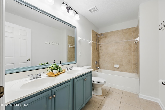 full bathroom featuring toilet, tile patterned flooring, visible vents, and a sink