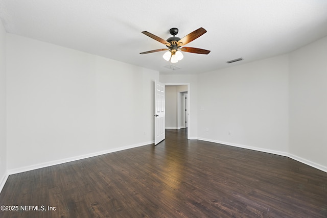 unfurnished room featuring ceiling fan, baseboards, visible vents, and dark wood finished floors