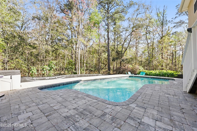 outdoor pool featuring a patio area