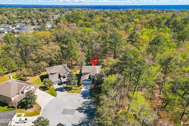 aerial view with a residential view and a wooded view