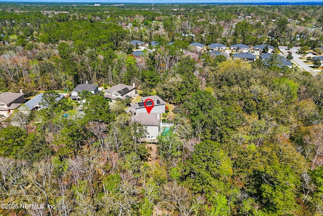 aerial view with a residential view and a wooded view