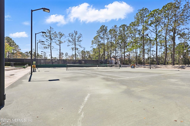 view of sport court with fence