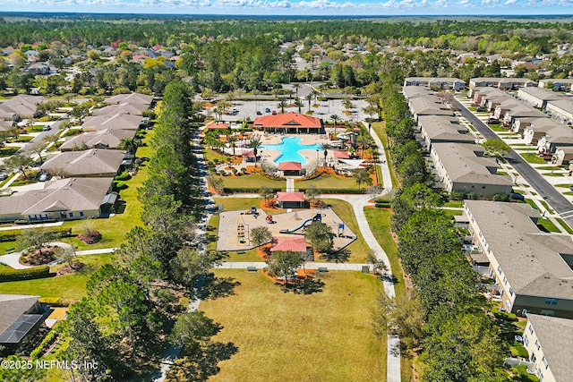 birds eye view of property with a residential view