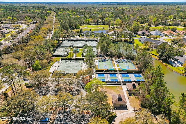 bird's eye view featuring a water view and a wooded view