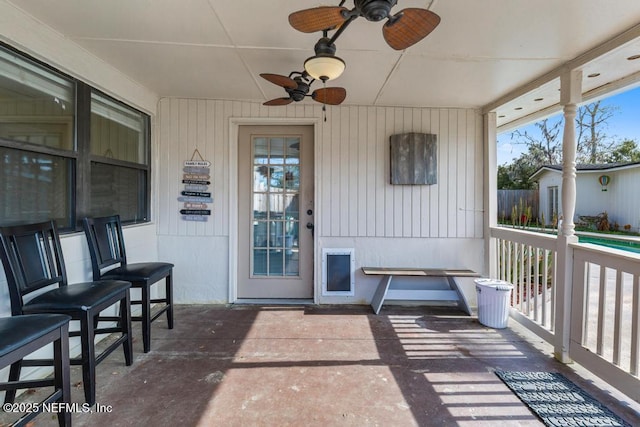 entrance to property featuring a ceiling fan