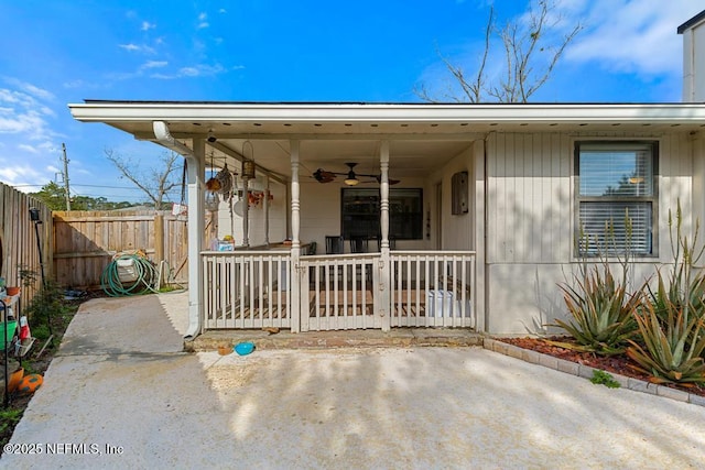 view of front of house featuring a patio, fence private yard, and a ceiling fan