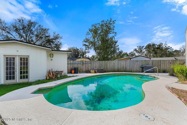 view of swimming pool featuring a fenced in pool, a patio area, and a fenced backyard