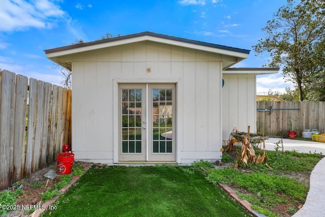 view of outbuilding with a fenced backyard and an outdoor structure