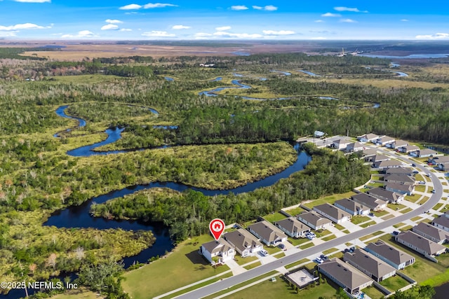 bird's eye view with a water view, a residential view, and a view of trees