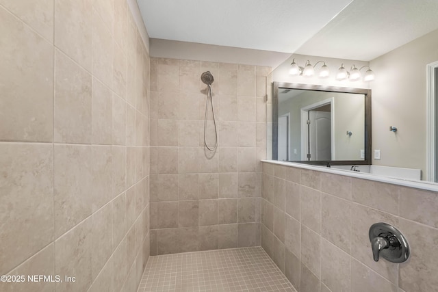 full bathroom featuring a tile shower