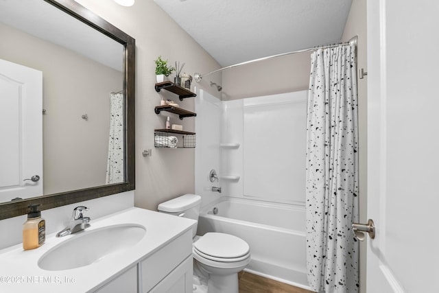 full bathroom featuring shower / tub combo, vanity, and toilet