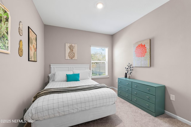 bedroom featuring carpet floors and baseboards