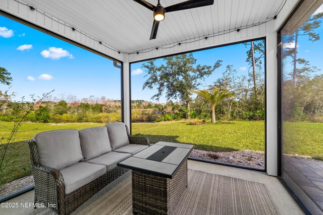 interior space with ceiling fan