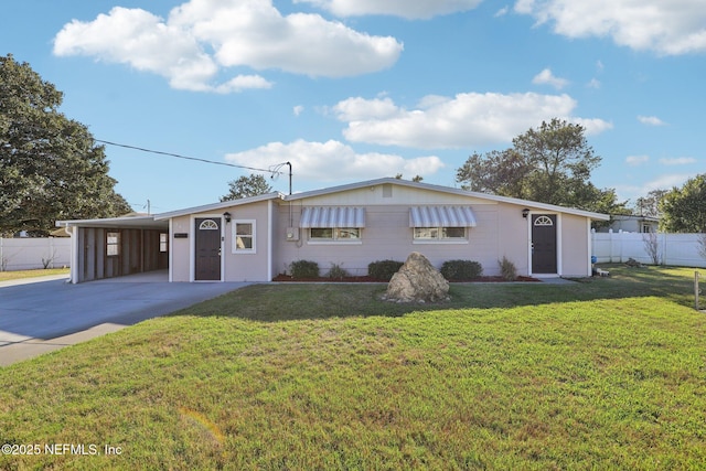 view of front of home featuring an attached carport, driveway, a front yard, and fence