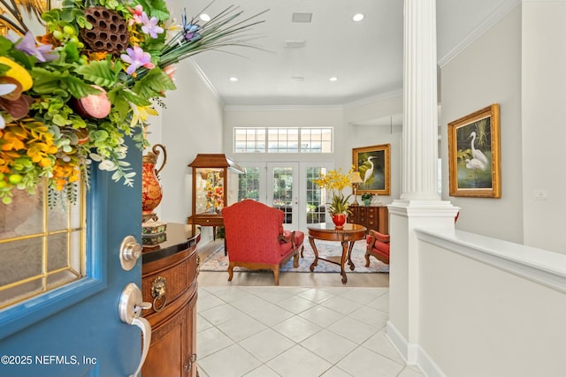 interior space featuring baseboards, ornamental molding, light tile patterned floors, decorative columns, and french doors