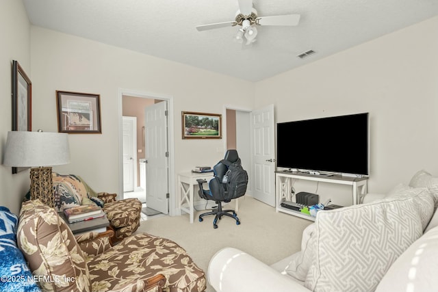 interior space with visible vents, a textured ceiling, and ceiling fan