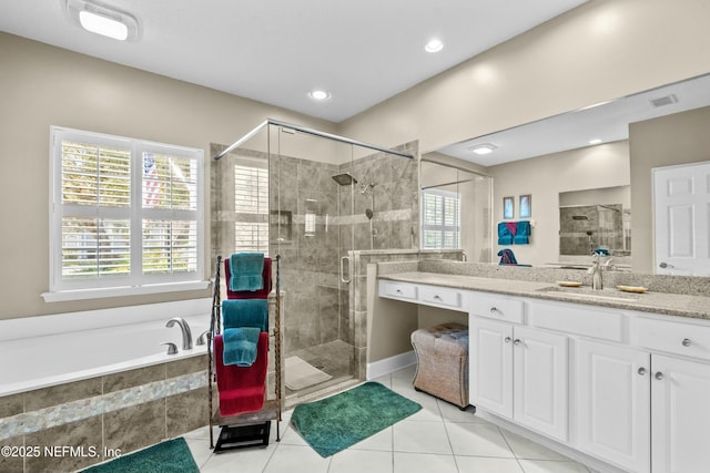 bathroom featuring visible vents, a shower stall, tile patterned floors, a bath, and vanity