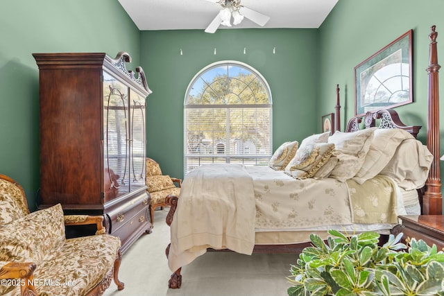 bedroom with a ceiling fan and carpet