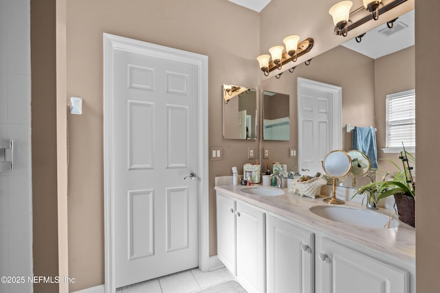 full bathroom with tile patterned floors, double vanity, visible vents, and a sink