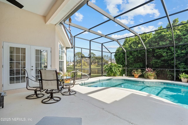 pool featuring a lanai and a patio area