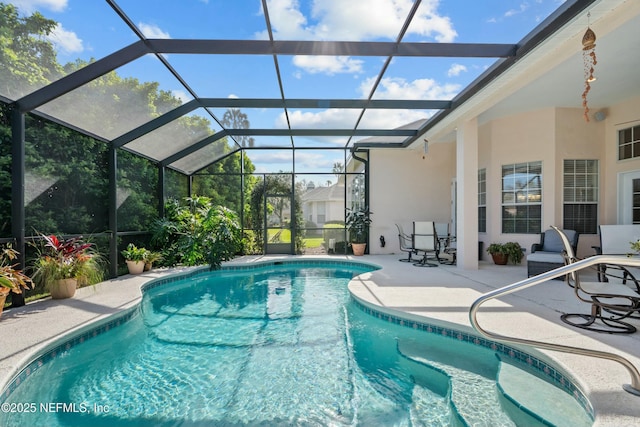 outdoor pool featuring a lanai and a patio area