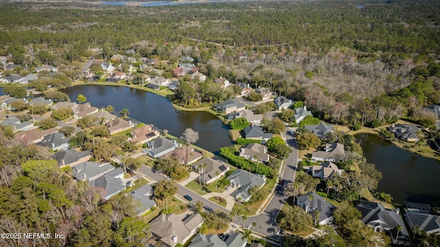 drone / aerial view with a residential view and a water view