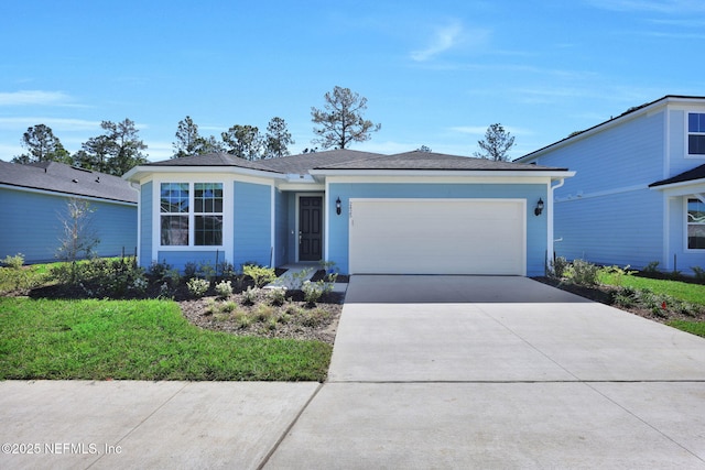 ranch-style home featuring driveway and a garage