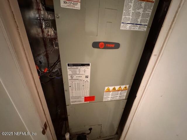 utility room with heating unit