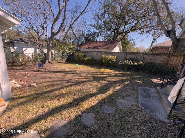 view of yard with a fenced backyard