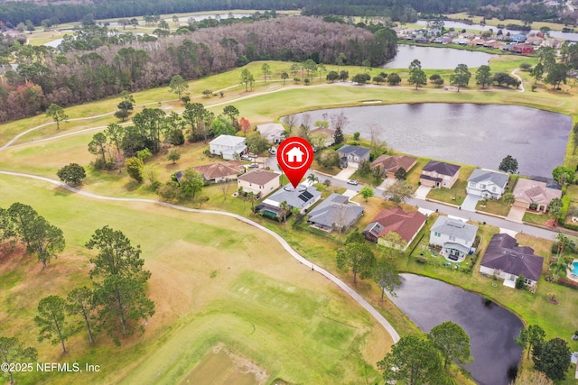 birds eye view of property featuring golf course view, a water view, and a residential view