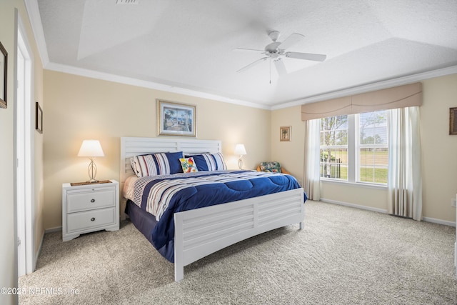 bedroom with a textured ceiling, ceiling fan, carpet floors, baseboards, and ornamental molding