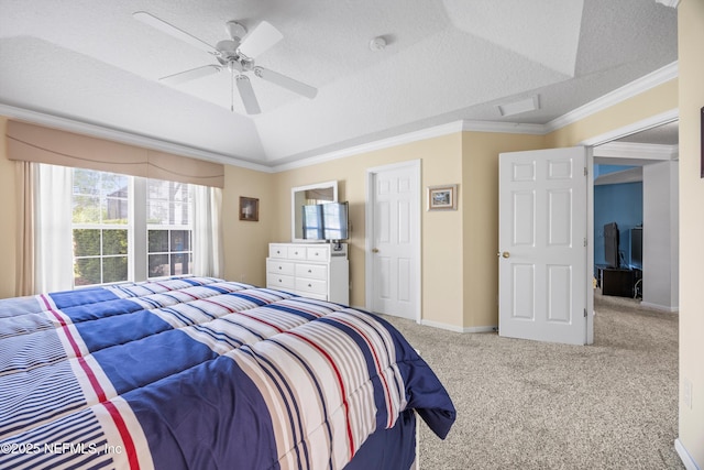 carpeted bedroom with a textured ceiling, lofted ceiling, a ceiling fan, baseboards, and ornamental molding