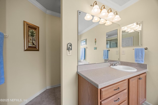 bathroom featuring crown molding, baseboards, vanity, and tile patterned floors